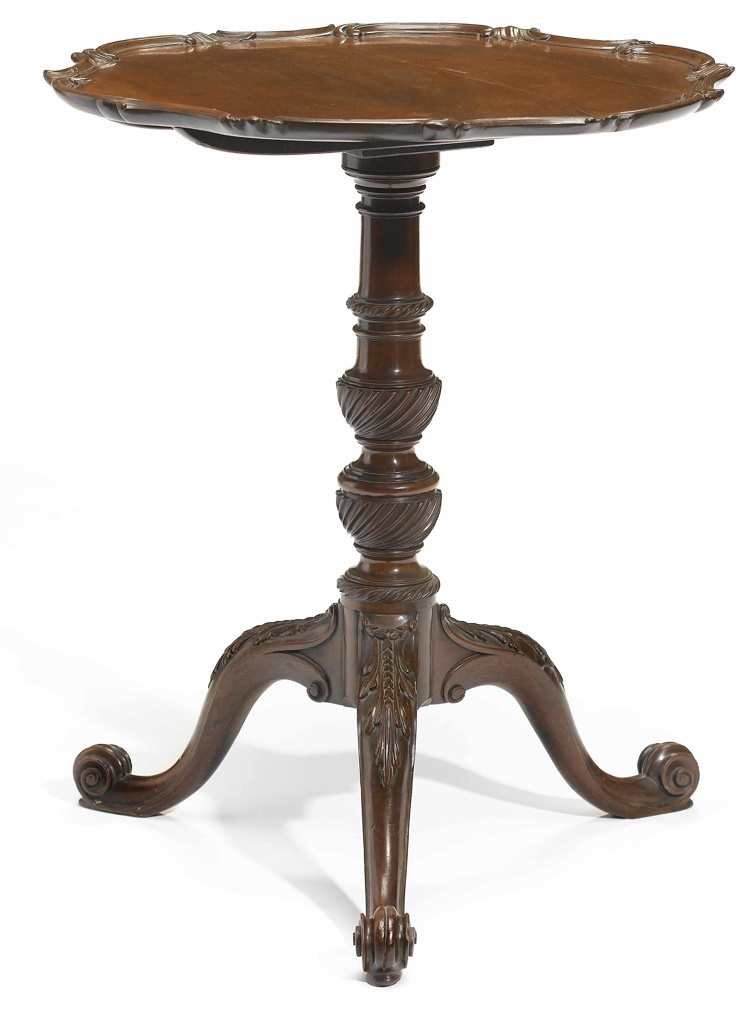 Appraisal: A George III carved mahogany tilt top occasional table third