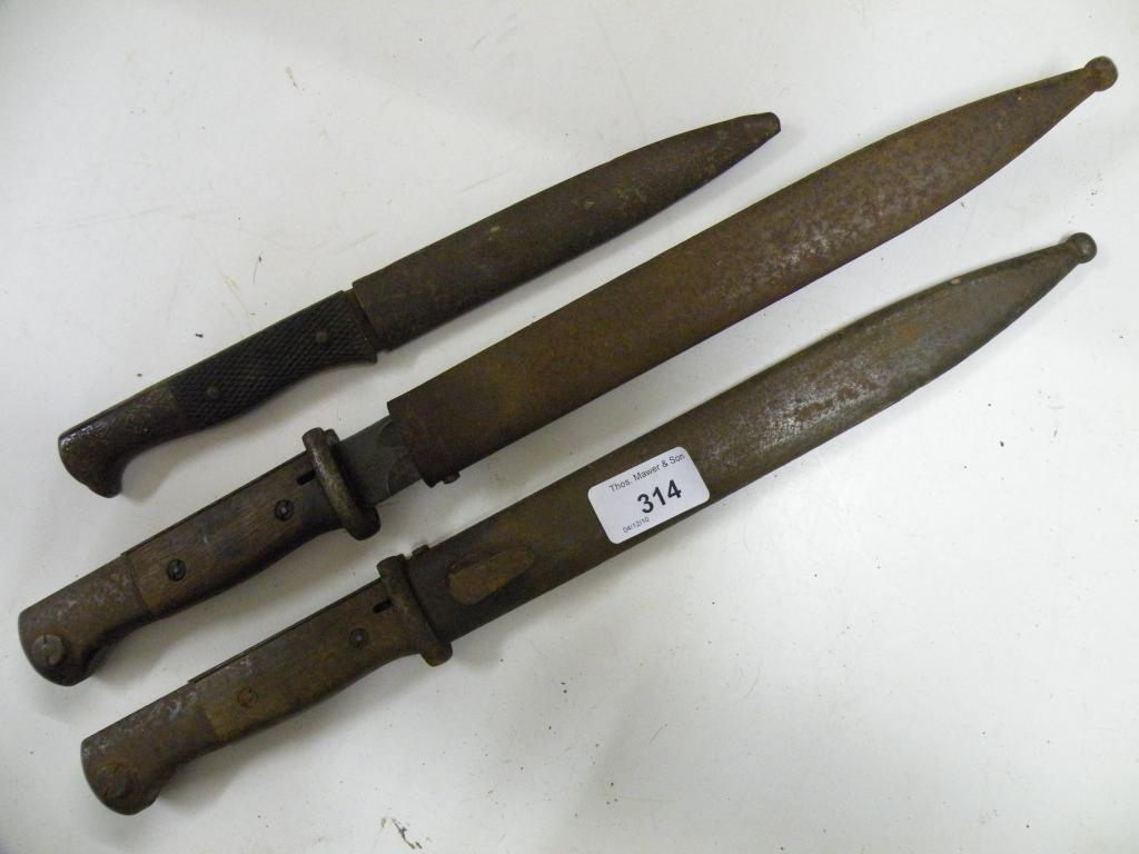 Appraisal: Two German bayonets and a Third Reich knife with Swastika