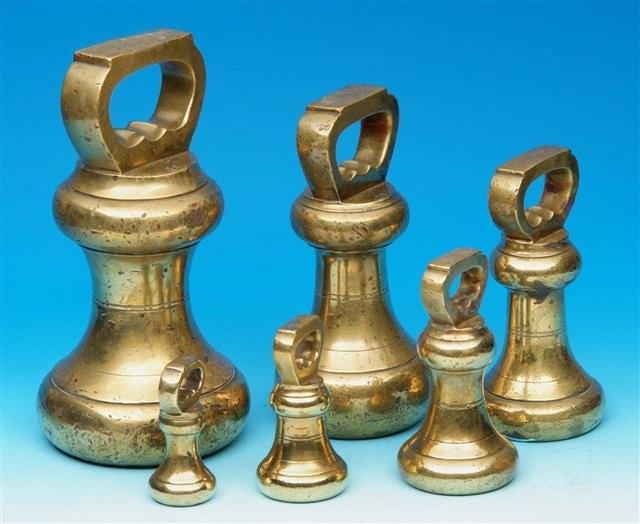 Appraisal: A GRADUATED SET OF SIX BRASS BELL WEIGHTS going from