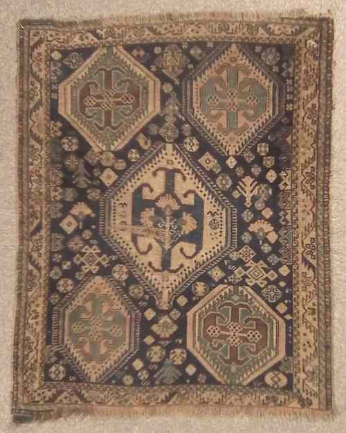 Appraisal: An antique North-west Persian rug woven in colours with five