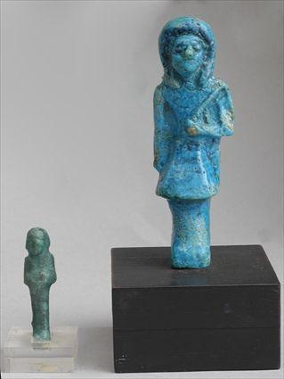 Appraisal: TWO EGYPTIAN FAIENCE USHABTIS Larger with brilliant blue glaze wearing