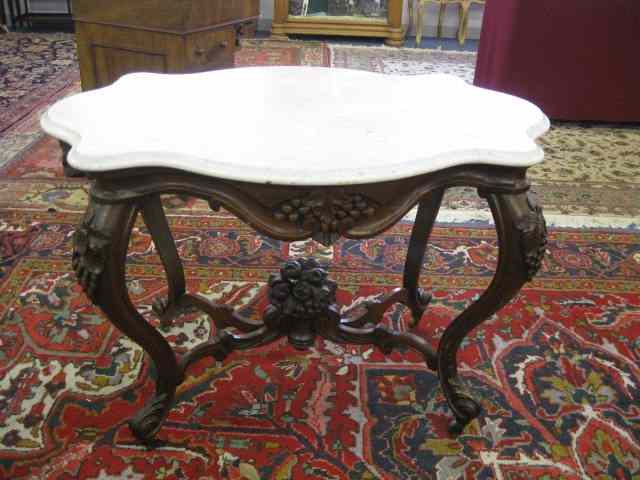 Appraisal: th Century Mahogany Marble Top Table carved basket of fruit