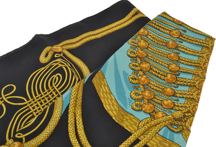 Appraisal: A SILK SCARF BY HERMES 'Brandebourgs' design depicting blue jacket