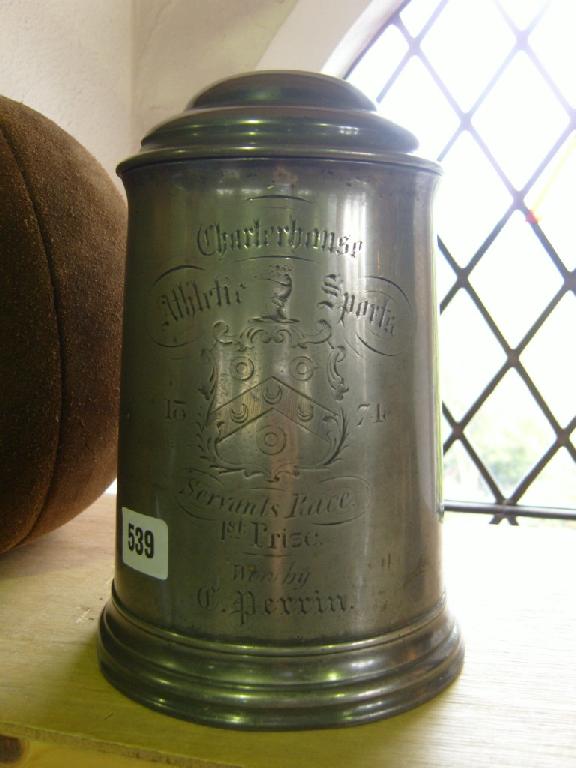 Appraisal: A large th century lidded pewter tankard with engraved crest