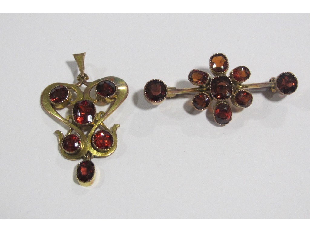 Appraisal: Edwardian yellow metal bar brooch set with topaz and a