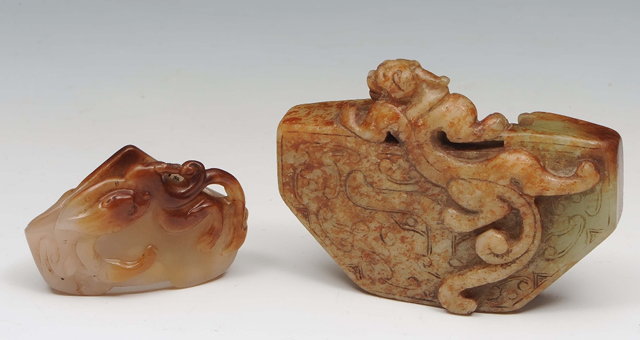 Appraisal: A Chinese mottled green and brown jade Han style piof