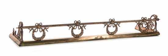 Appraisal: A Neoclassical Copper Fire Fender decorated with four ribbon-tied bellflower