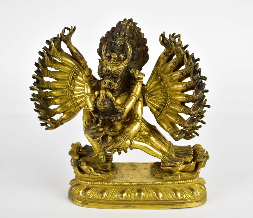 Appraisal: SINO-TIBETAN GILT BRONZE MULTI-ARMED DEITY W CONSORT th Century or