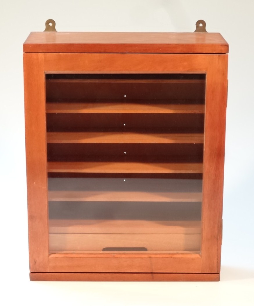 Appraisal: A thC hanging display cabinet the glazed hinged door revealing