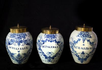 Appraisal: Three Delft tobacco jars late th Century with brass covers