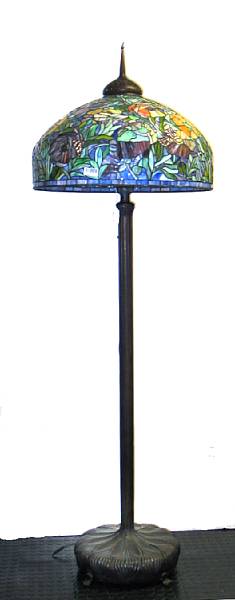 Appraisal: A Tiffany style leaded slag glass and bronze floor lamp