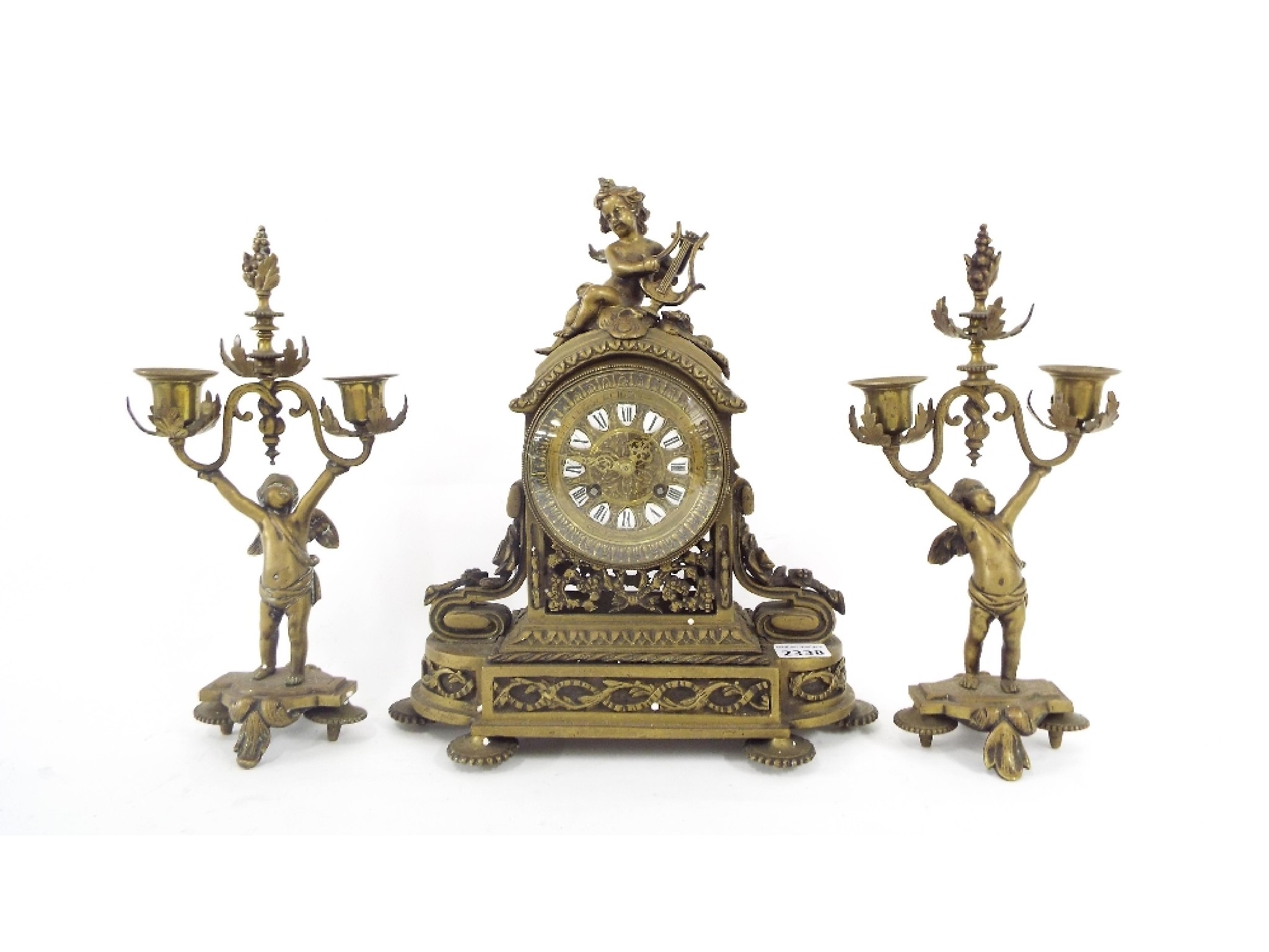 Appraisal: Brass two train mantel clock garniture the movement with outside