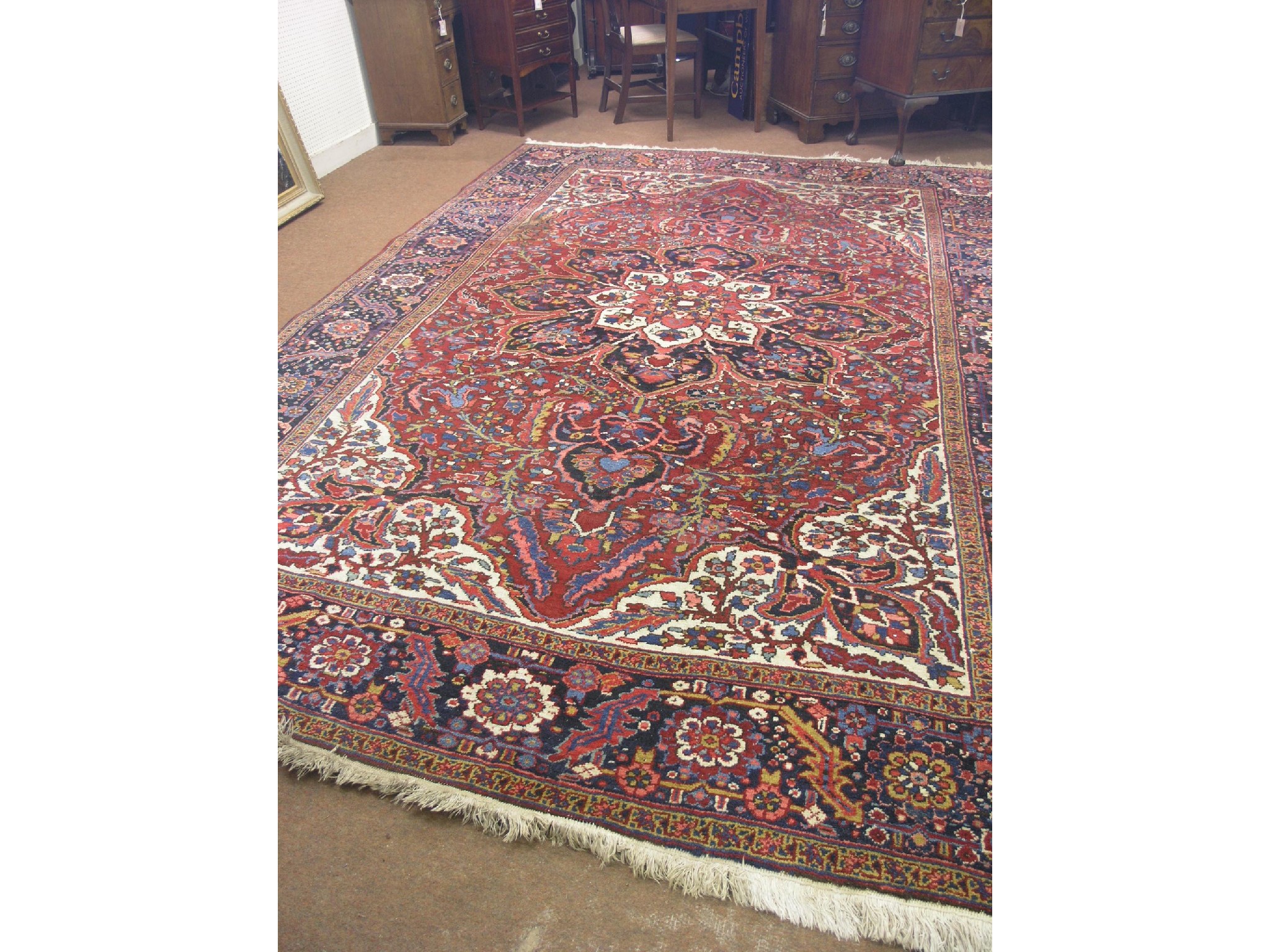 Appraisal: An Indian wool rug multi-coloured design predominantly in blue cream