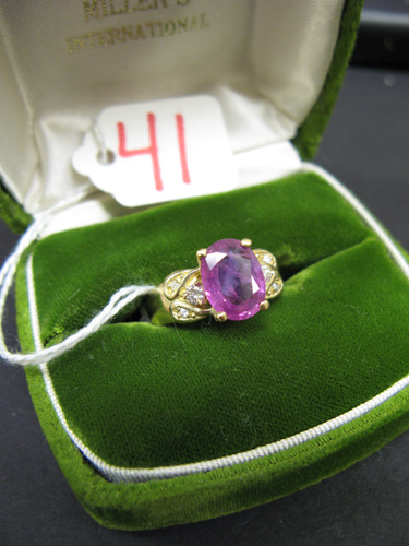 Appraisal: PINK SAPPHIRE DIAMOND AND FOURTEEN KARAT GOLD RING centering an