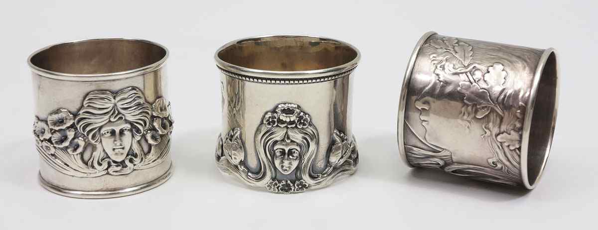 Appraisal: ART NOUVEAU STERLING SILVER NAPKIN RINGS Circular ones with female