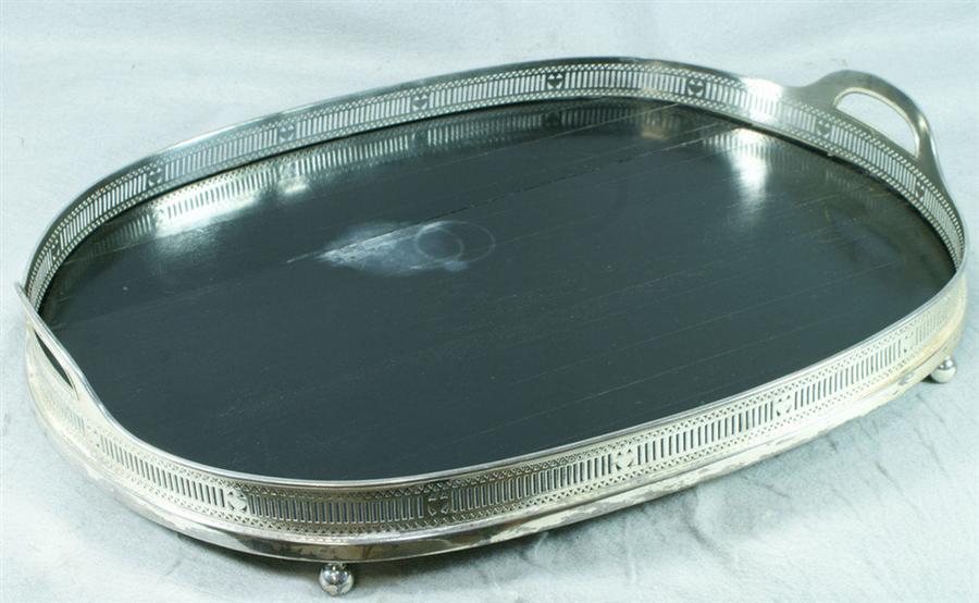 Appraisal: Oval plated silver tray with pierced rim teakwood bottom with