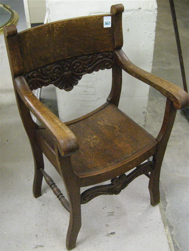 Appraisal: AN OAK ARMCHAIR AND LAMP TABLE American c - The