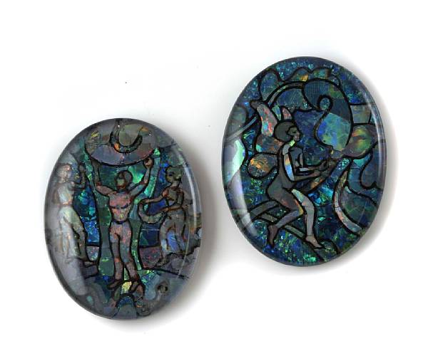 Appraisal: A set of two oval opal cabochons carved black opal