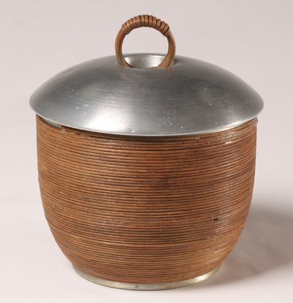 Appraisal: Russel Wright spun aluminum covered ice bucket with rattan handle