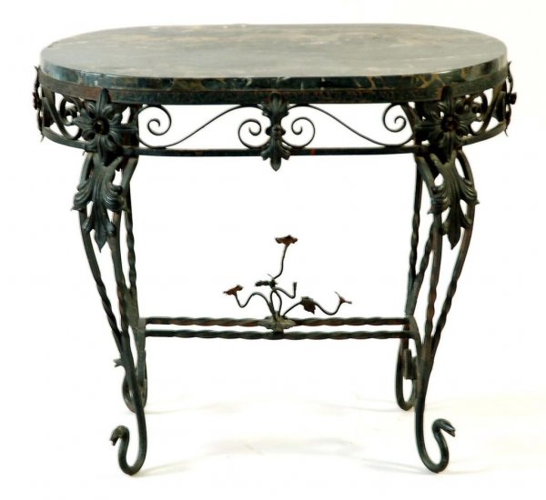 Appraisal: A wrought cast iron rococo form stand with a slightly