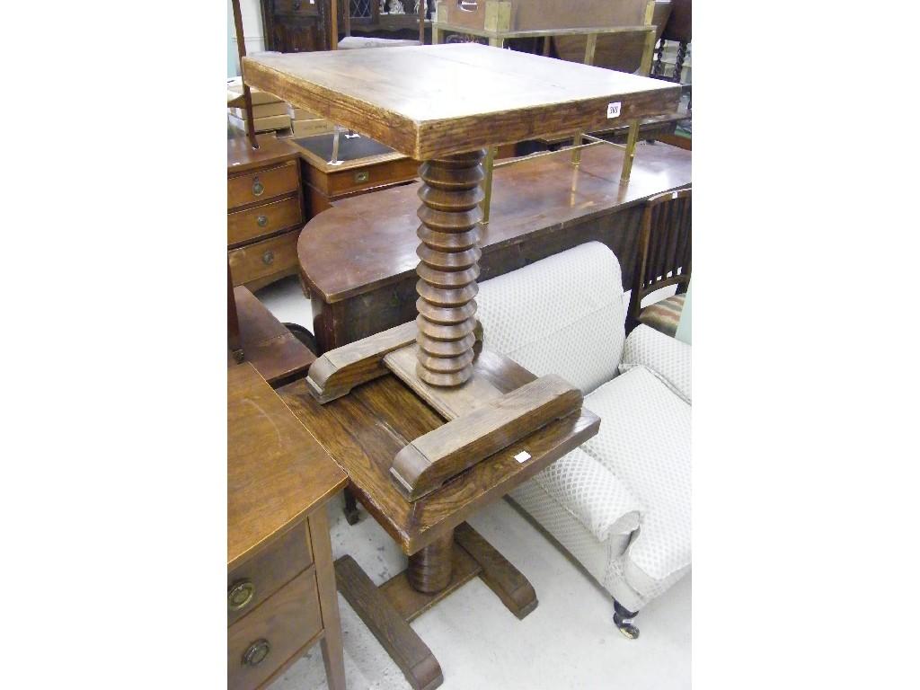 Appraisal: Pair of French oak cafe tables each with square tops