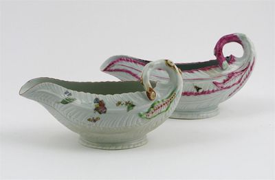 Appraisal: Two Worcester lettuce leaf sauce boats painted with butterflies and