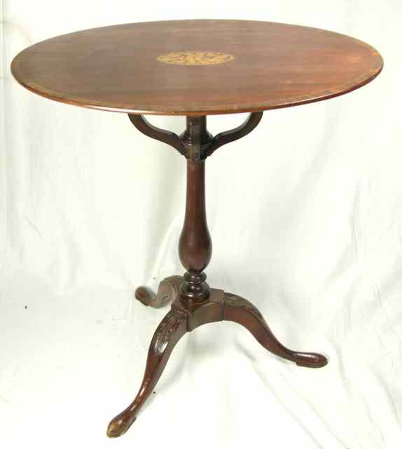 Appraisal: A th Century mahogany oval table the top crossbanded and