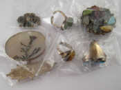 Appraisal: A mixed lot comprising three white metal tests silver stone