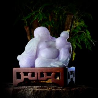 Appraisal: A Lavender Jade Buddha Featuring a carved lavender jade laughing