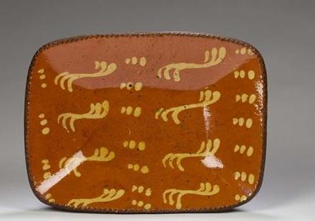 Appraisal: PENNSYLVANIA SLIP-DECORATED GLAZED REDWARE LOAF DISH MID-NINETEENTH CENTURY Decorated in