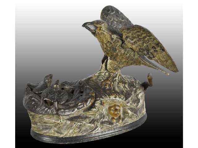 Appraisal: Cast Iron Eagle and Eaglets Mechanical Bank Description All original