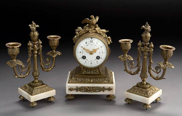 Appraisal: A Louis XVI style gilt bronze mounted white marble clock