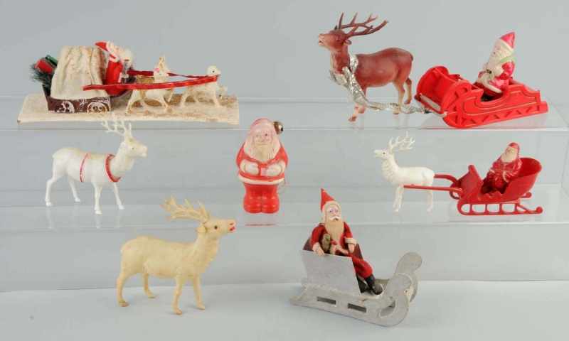 Appraisal: Lot of Santa Decorations Description Includes four Santas in sleighs