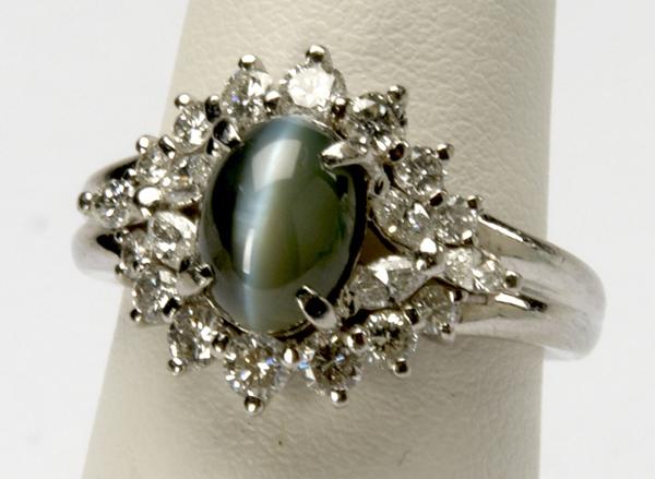 Appraisal: CAT S EYE CHRYSOBERYL AND DIAMOND RING Platinum mount oval