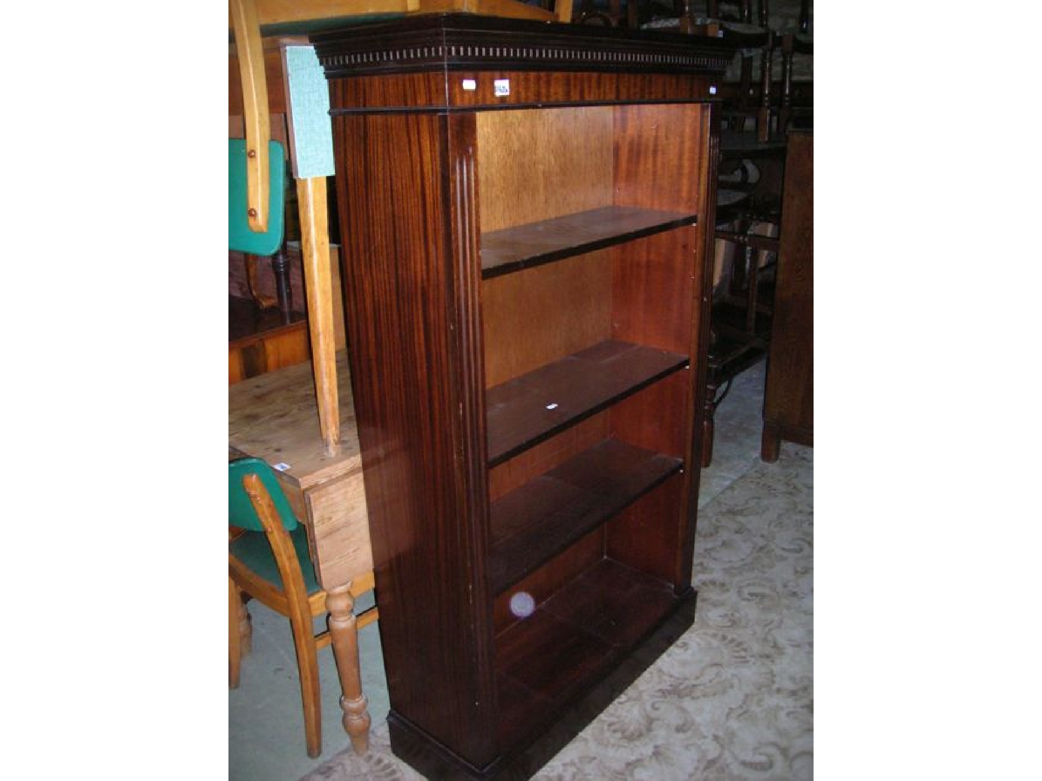 Appraisal: A reproduction mahogany freestanding open bookcase in the Georgian style