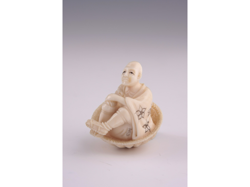 Appraisal: Netsuke Carved Ivory of a man seated in a basket