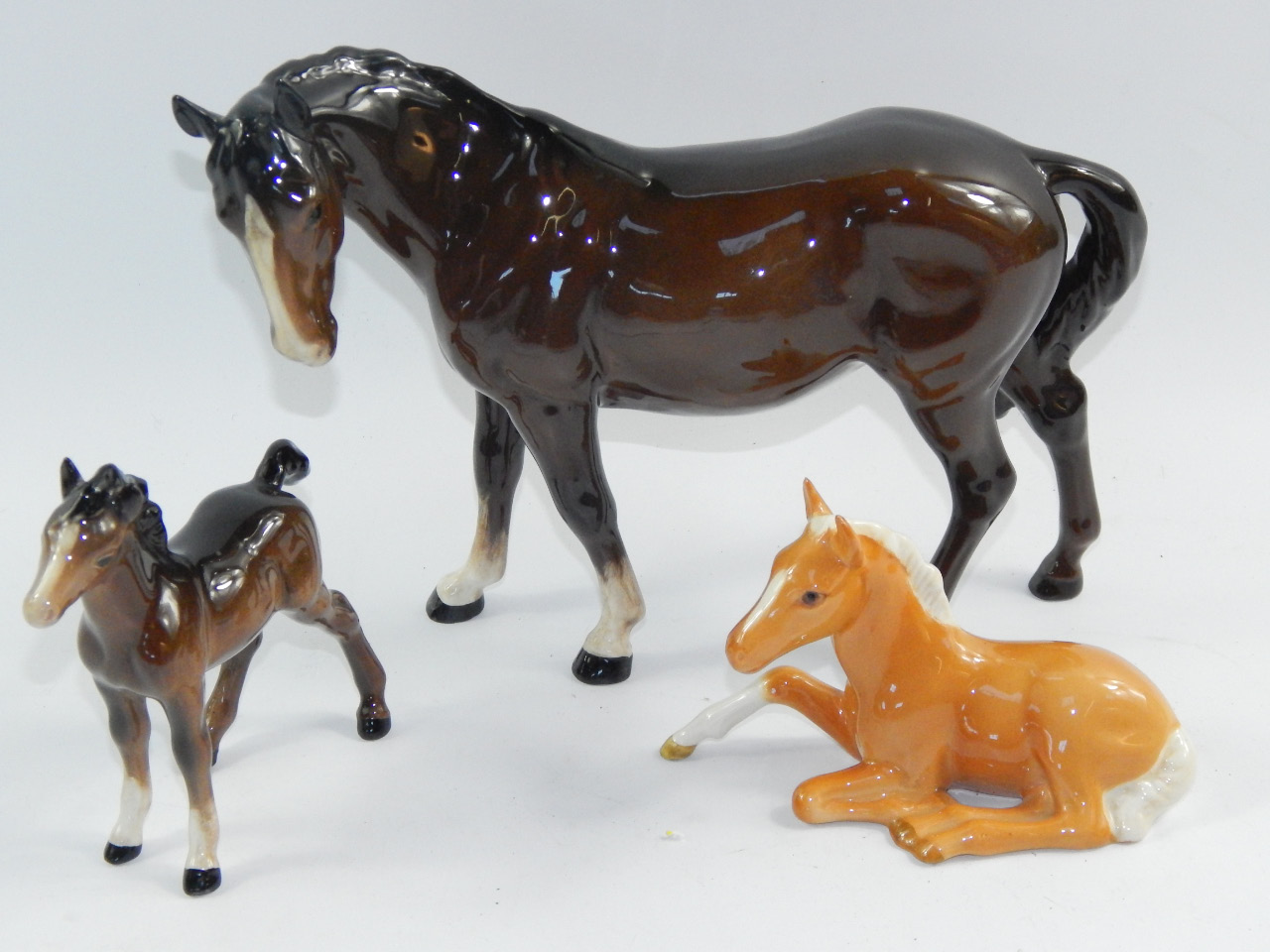 Appraisal: A Beswick brown gloss horse foal and a recumbent Palomino