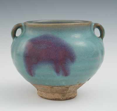 Appraisal: A Chinese Jun Ware Handled Jar Blue glaze over stoneware