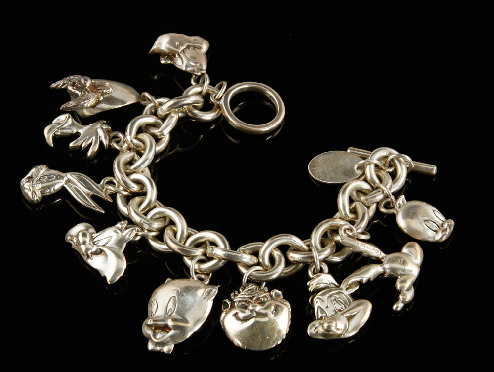 Appraisal: - Sterling Silver Charm Bracelet Sterling silver charm bracelet with