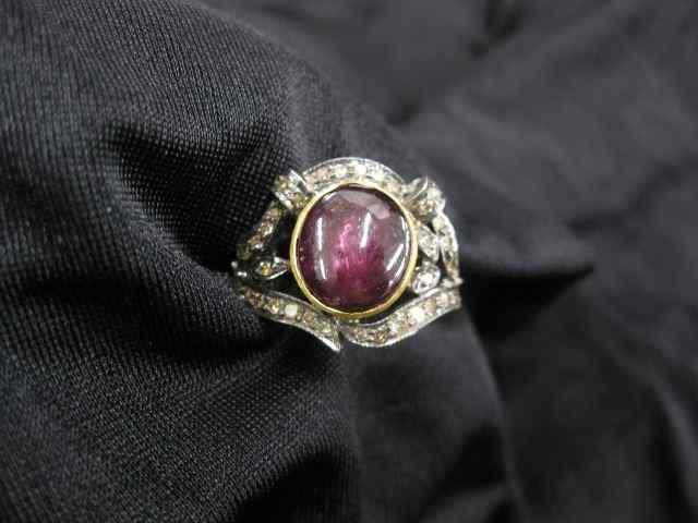 Appraisal: Star Ruby Diamond Ring carat deepreddish purple ruby surrounded by