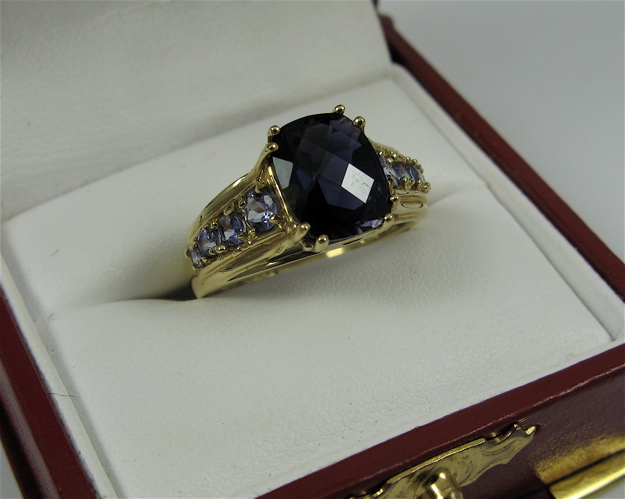 Appraisal: IOLITE AND K GOLD RING centering a checkerboard-cut iolite weighing