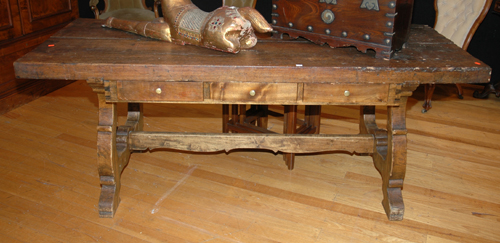 Appraisal: A RUSTIC OAK REFECTORY TABLE The rectangular top with three