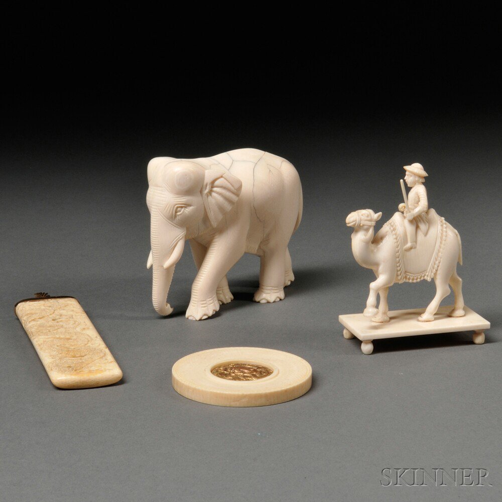 Appraisal: Four Ivory Carvings Asia an elephant ht a man riding