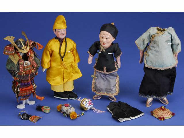 Appraisal: Lot Four Oriental Dolls Three composition dolls and miniature Samari