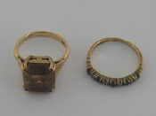 Appraisal: Two carat gold rings the first set with citrine finger