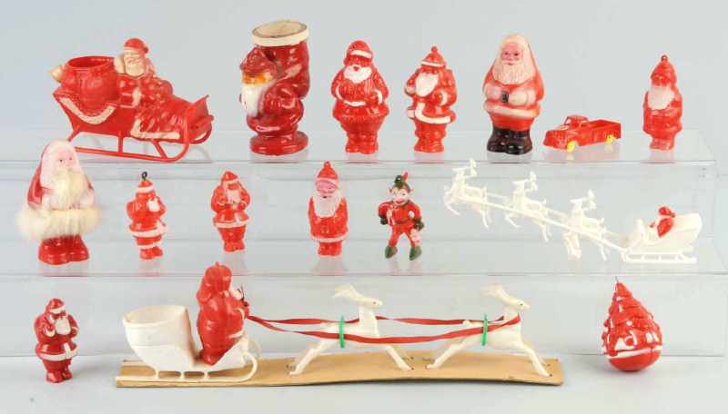 Appraisal: Lot of Plastic Santa Decorations Description Includes two Santas with