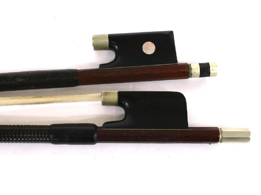 Appraisal: Nickel mounted violin bow stamped Tubbs and a three-quarter size