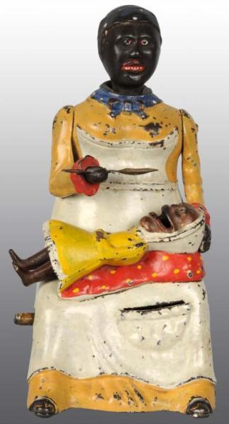 Appraisal: Cast Iron Mammy with Spoon Mechanical Bank Description Manufactured by