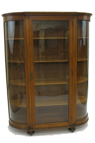 Appraisal: VICTORIAN OAK AND CURVED GLASS CHINA DISPLAY CABINET American late