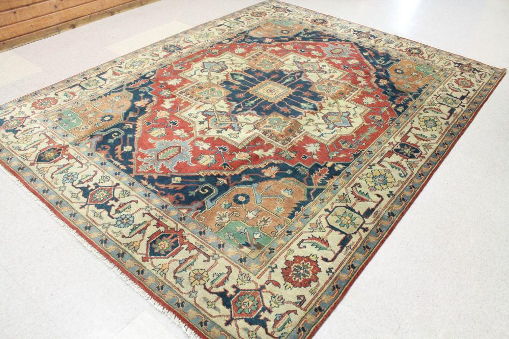 Appraisal: HAND KNOTTED ORIENTAL CARPET Indo-Serapi central medallion and stylized floral